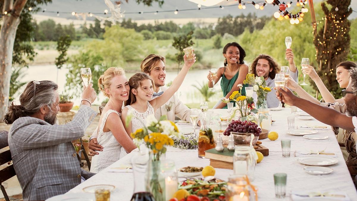 Article Cards Featured Image Young couple guests toasting champagne during wedding reception