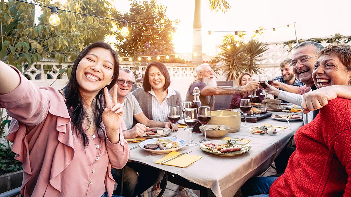 Article Cards Featured Image Happy family cheering and toasting with red wine glasses at dinn