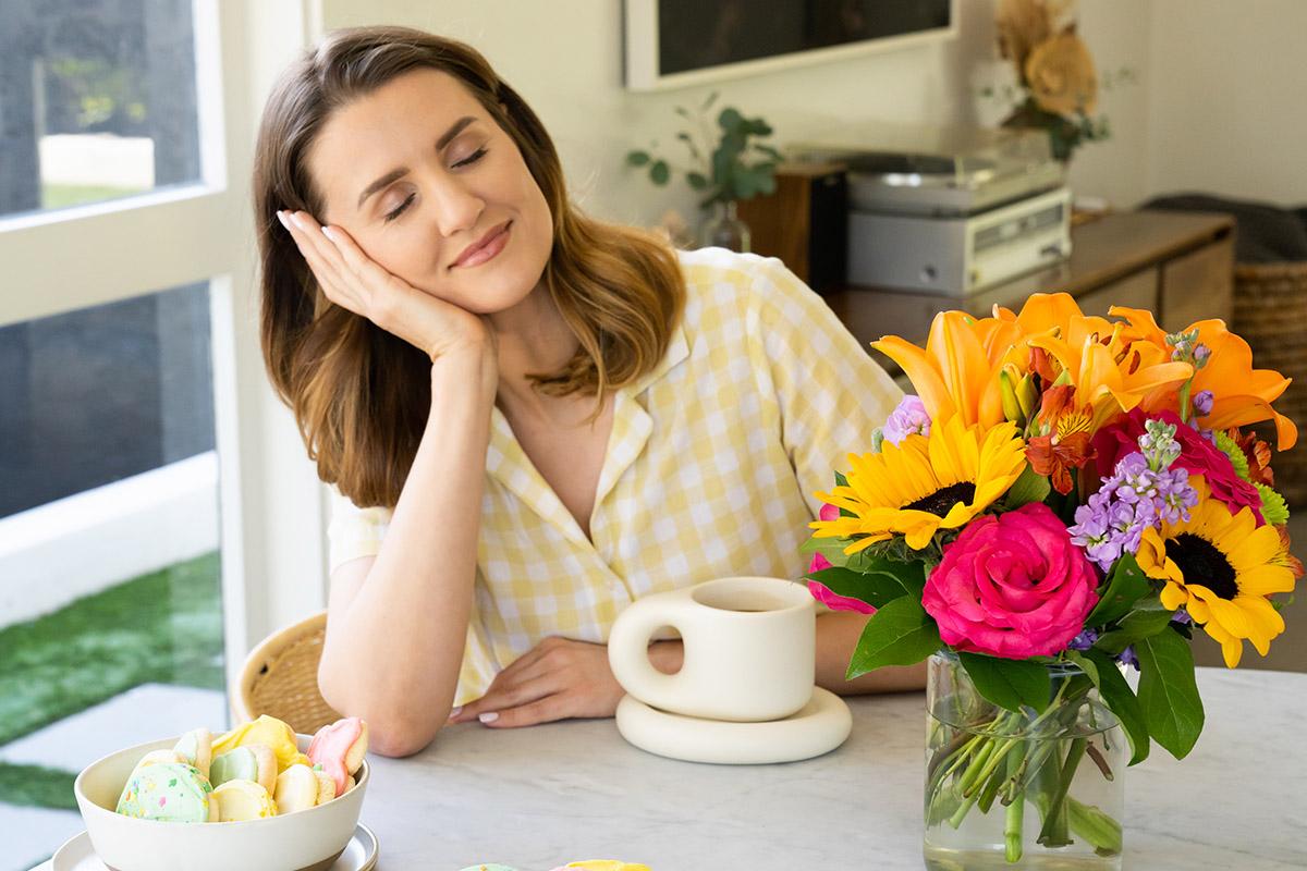 Article Cards Featured Image spring self care ideas with woman relaxing at table