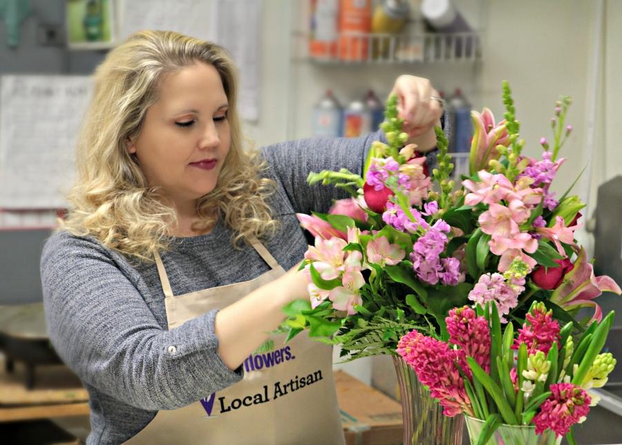 Article Cards Featured Image Develyn Reed working on a floral arrangement