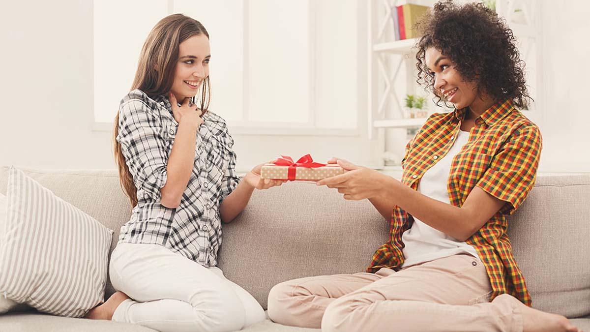 Article Cards Featured Image Happy girls exchanging gifts. Excited woman getting present from her friend. Birthday, holidays, celebration and female friendship concept, copy space