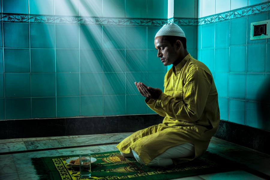 winter holidays with Muslim Man Praying During Mawlid al Nabi