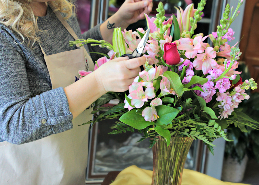 Develyn creating floral arrangement