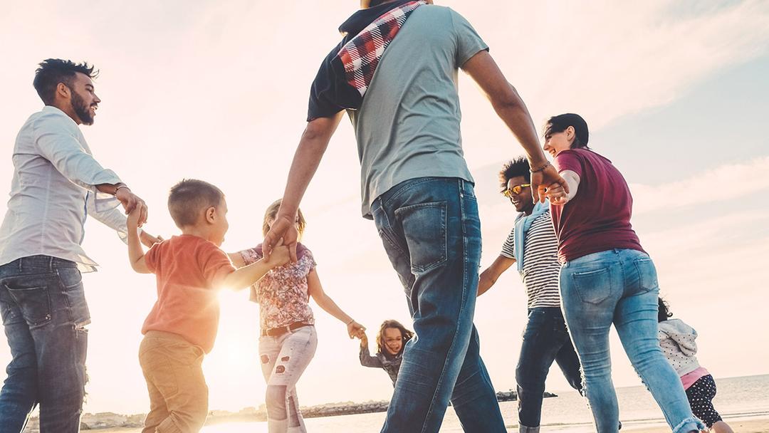 Family reunion ideas with family playing games at the beach