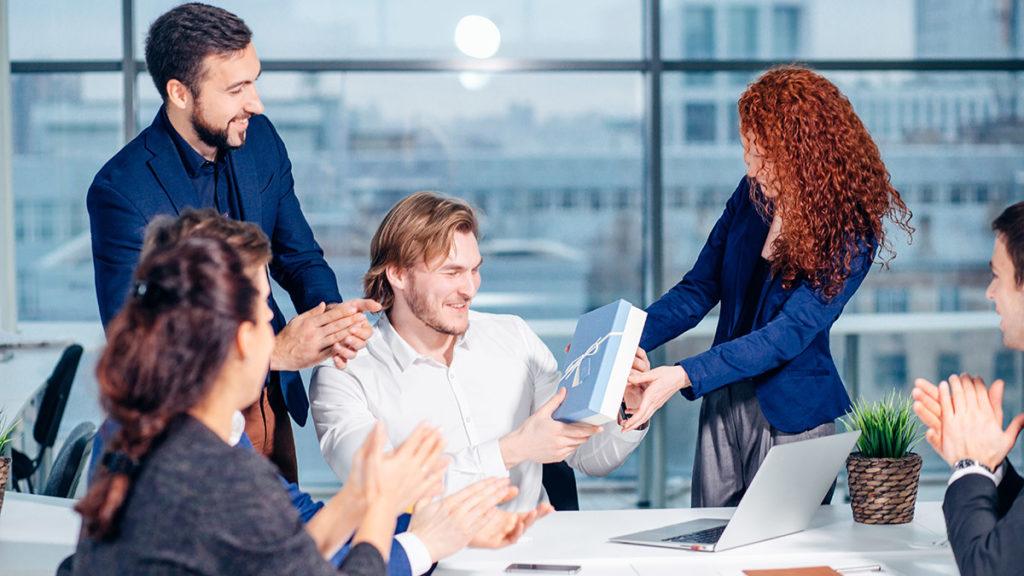 How to say thank you with colleagues celebrating birthday party in office giving presents to boss