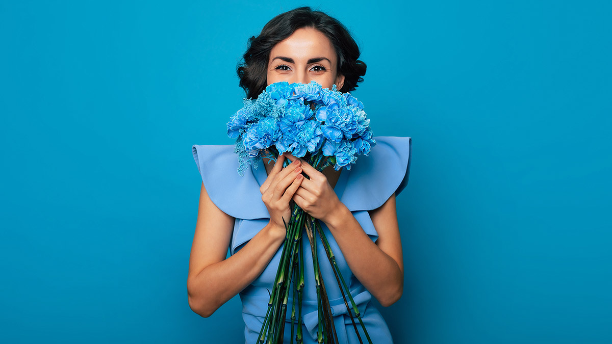 birthday gifts for libra with woman holding blue flowers