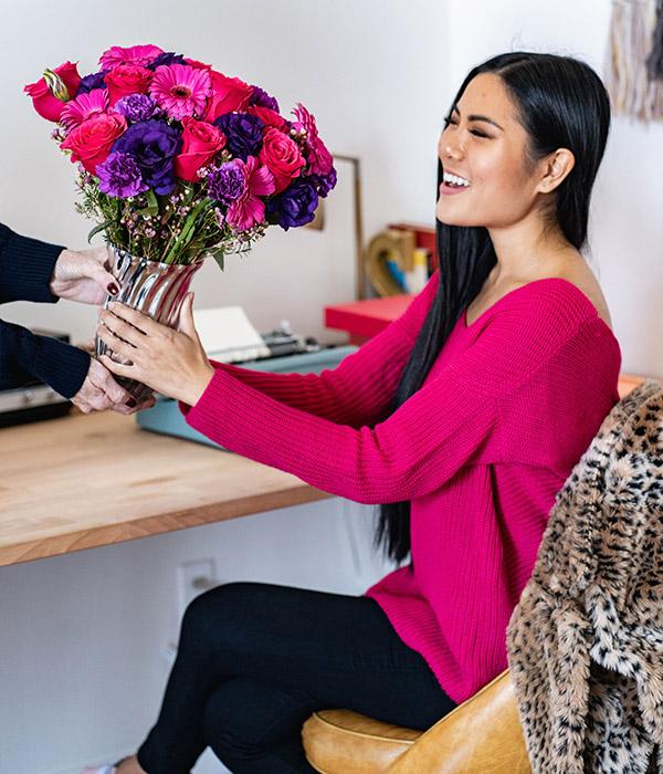 long distance valentine with woman getting flowers at work