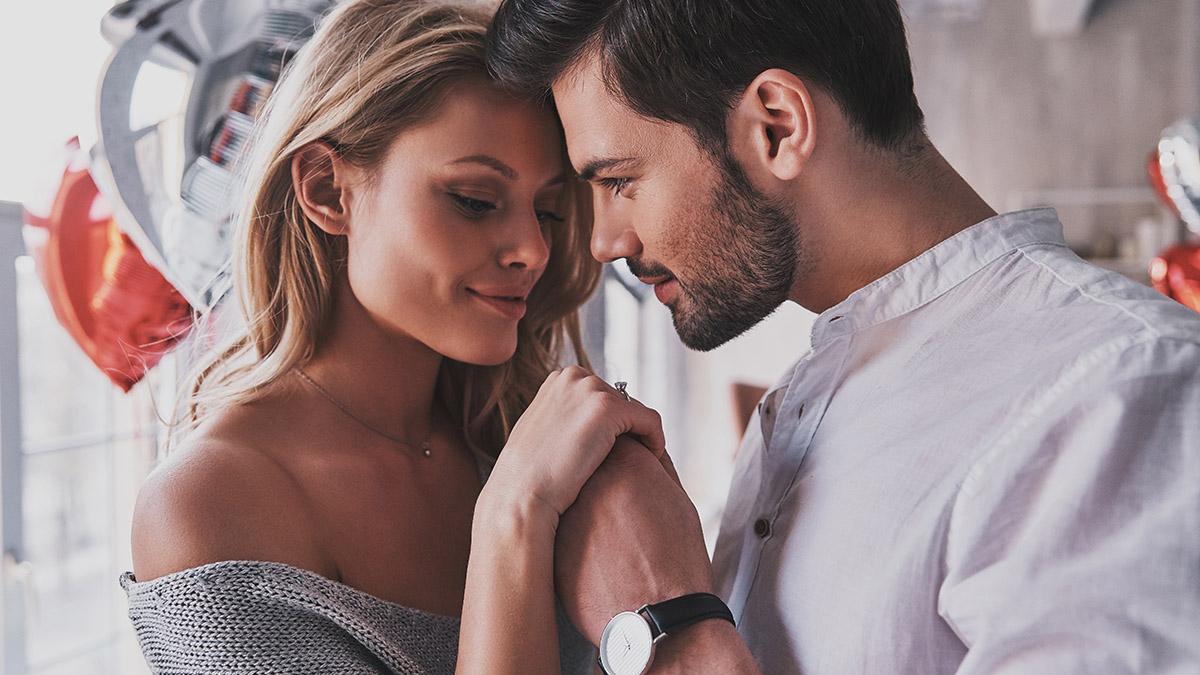 anniversary wishes with young couple holding hands