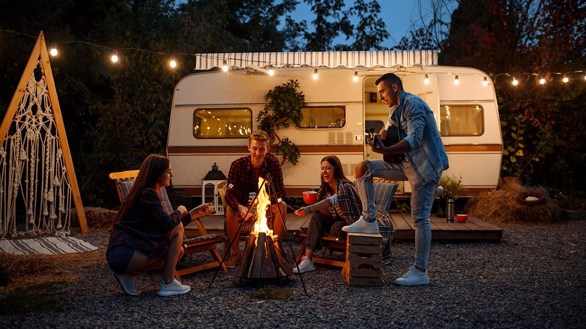 th birthday ideas with Friends warming themselves by the bonfire, camping